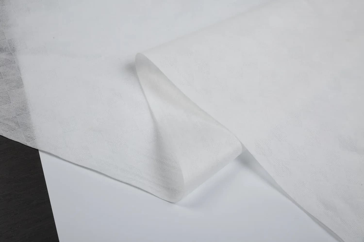 Safe-Guard FR-treated spunlace large square pattern white 60gsm protective fabric sample